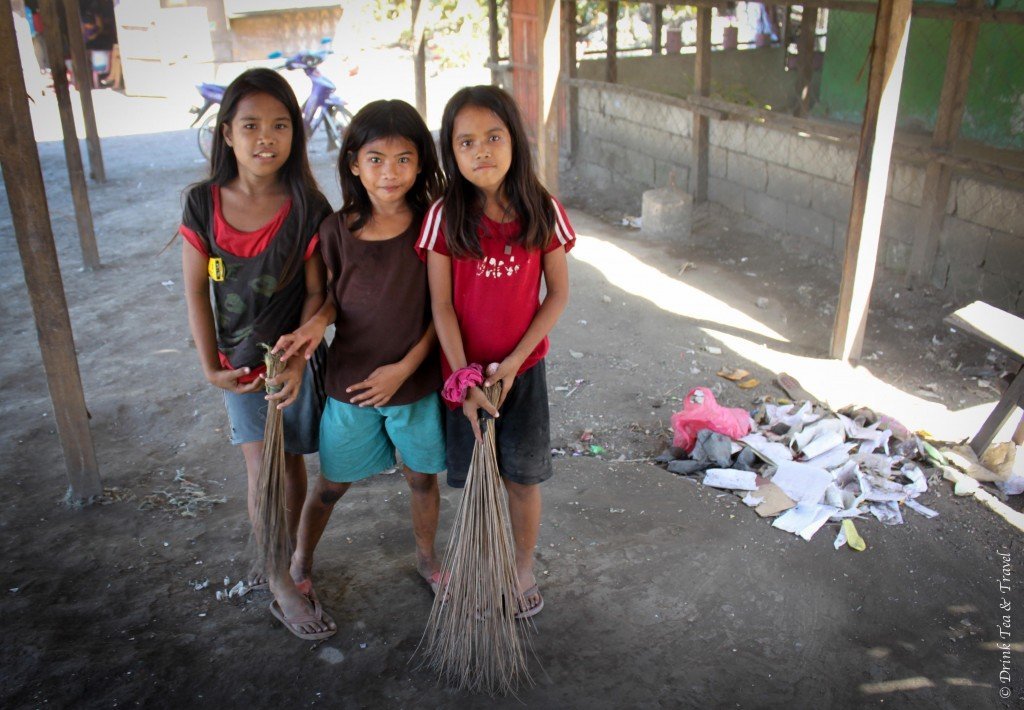 Girls cleaning up at a dumpsite in Liloan, Cebu, Philippines